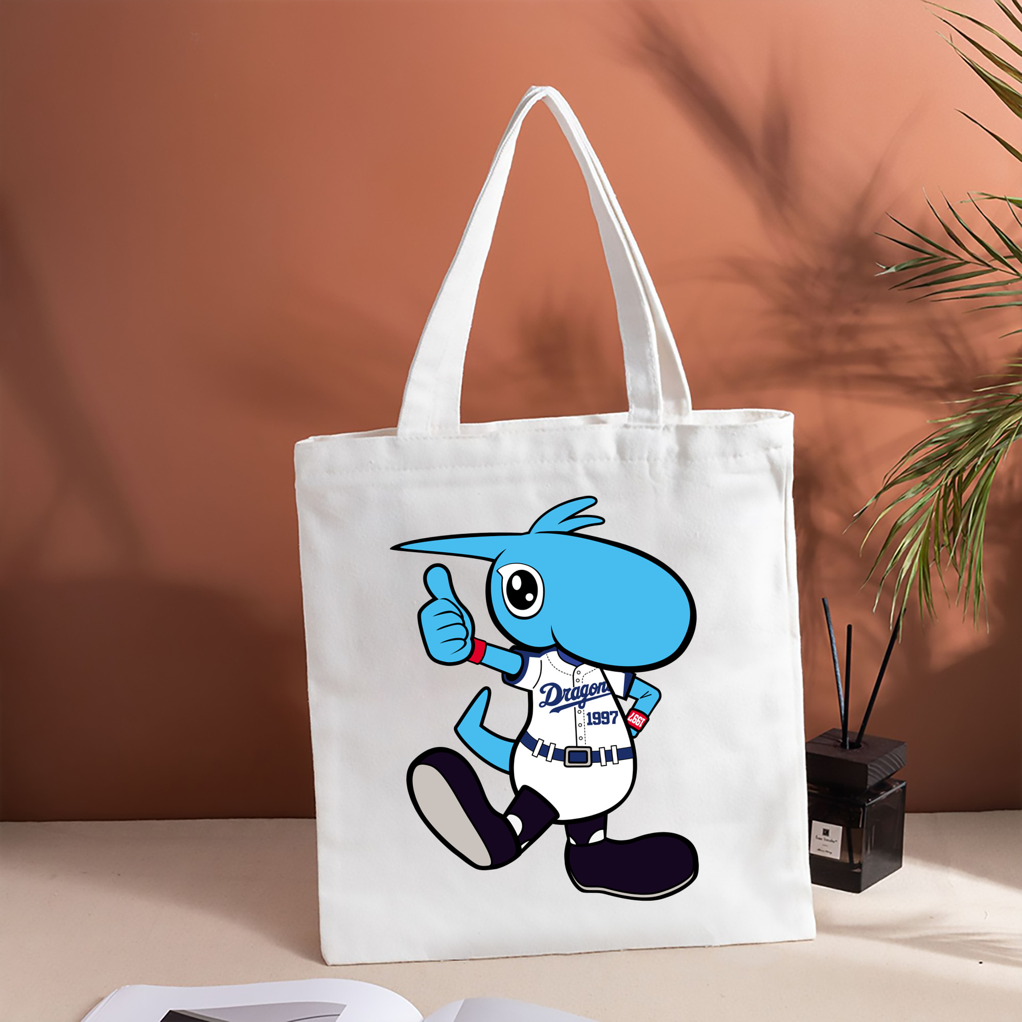 CHUNICHI DRAGONS MASCOT SHAOLON APPLICATION 2017 2018 HOME UNIFORM THUMBS UP Logo